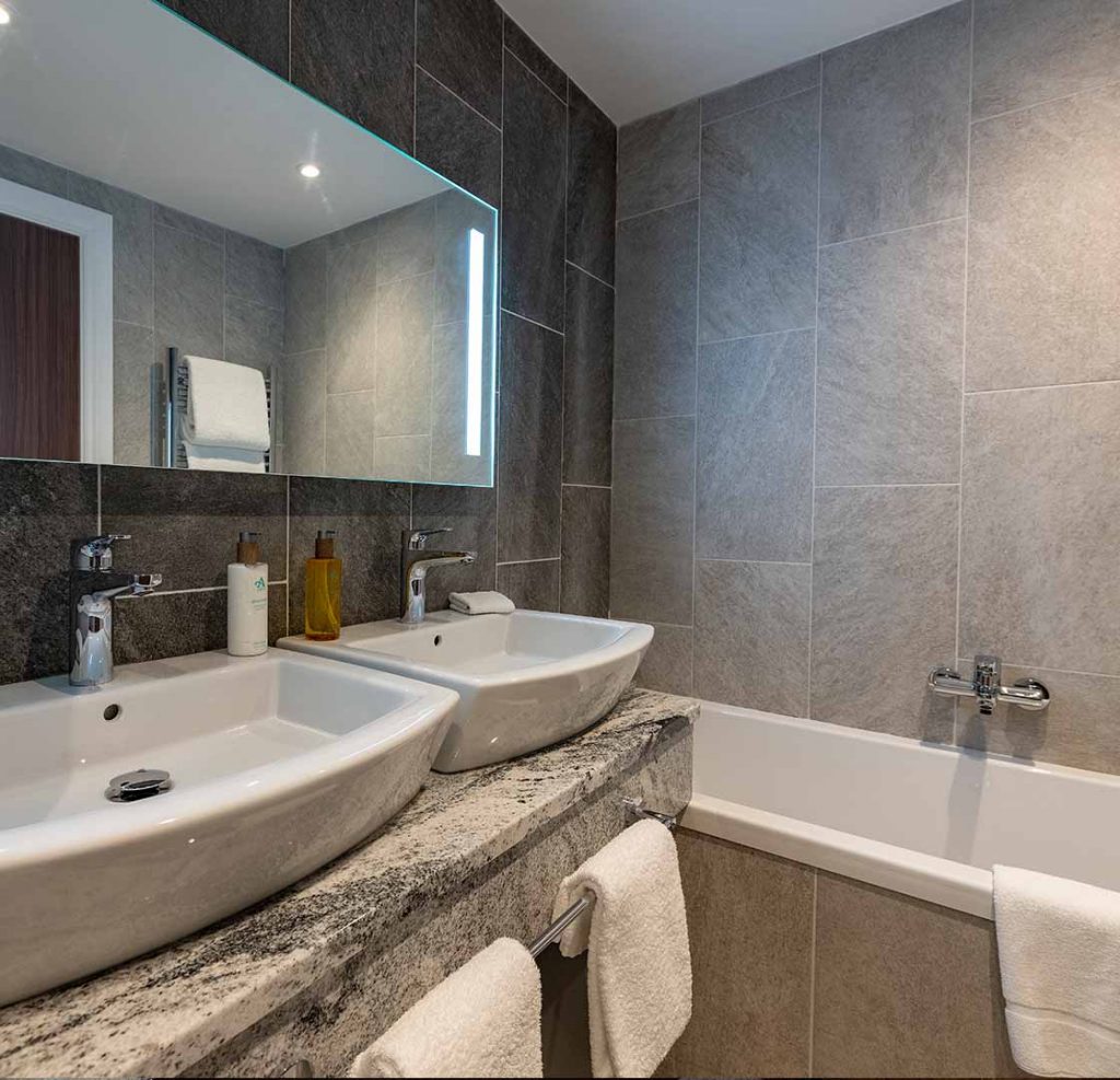 Luxury bathroom with twin sinks in a room at Ness Walk hotel in Inverness