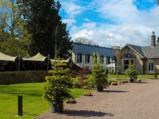 Exterior view of Ness Walk Hotel and Bruach Bar on a sunny day