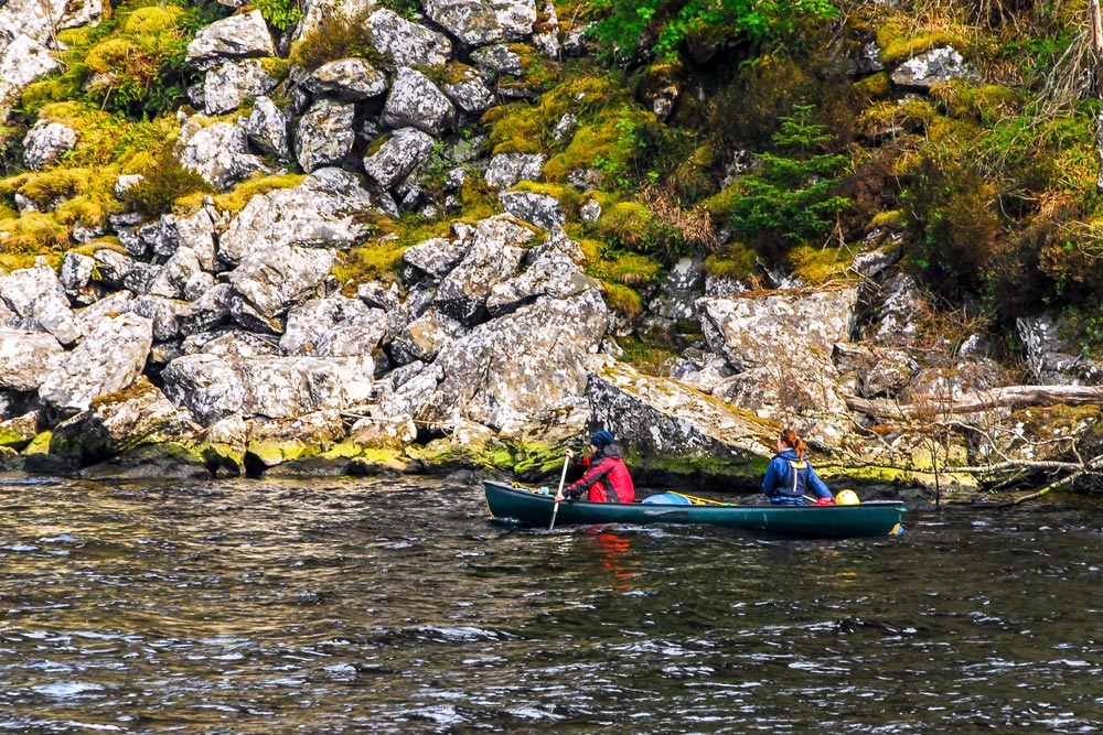 Two people canoeing on the waters of Loch Ness
