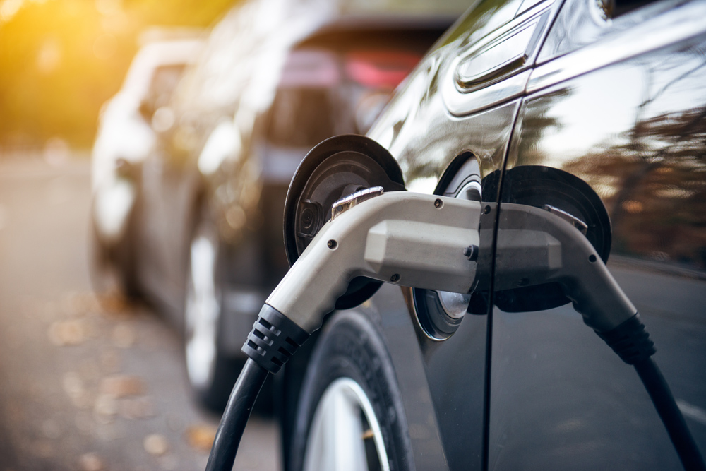 Car at an electric charging point