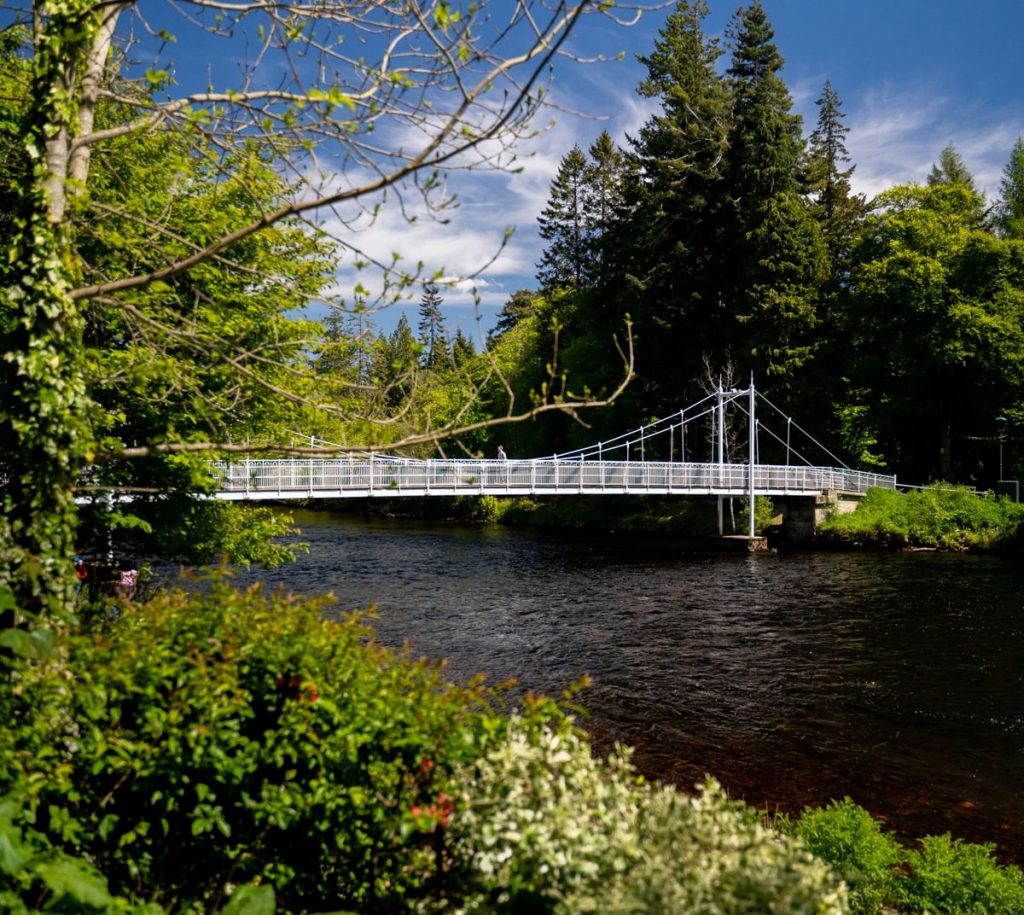 spring morning with traditional bridge over river