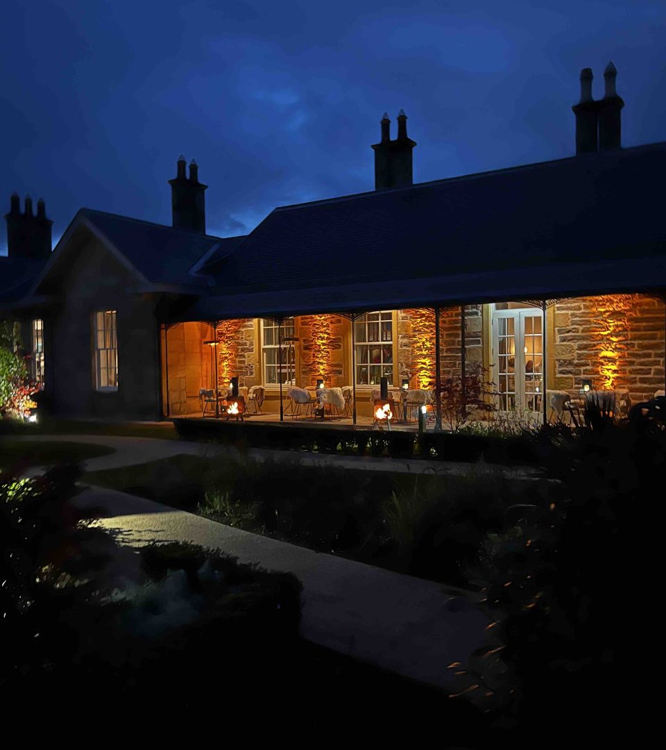 The Victorian Terrace lit up at night at Ness Walk Hotel