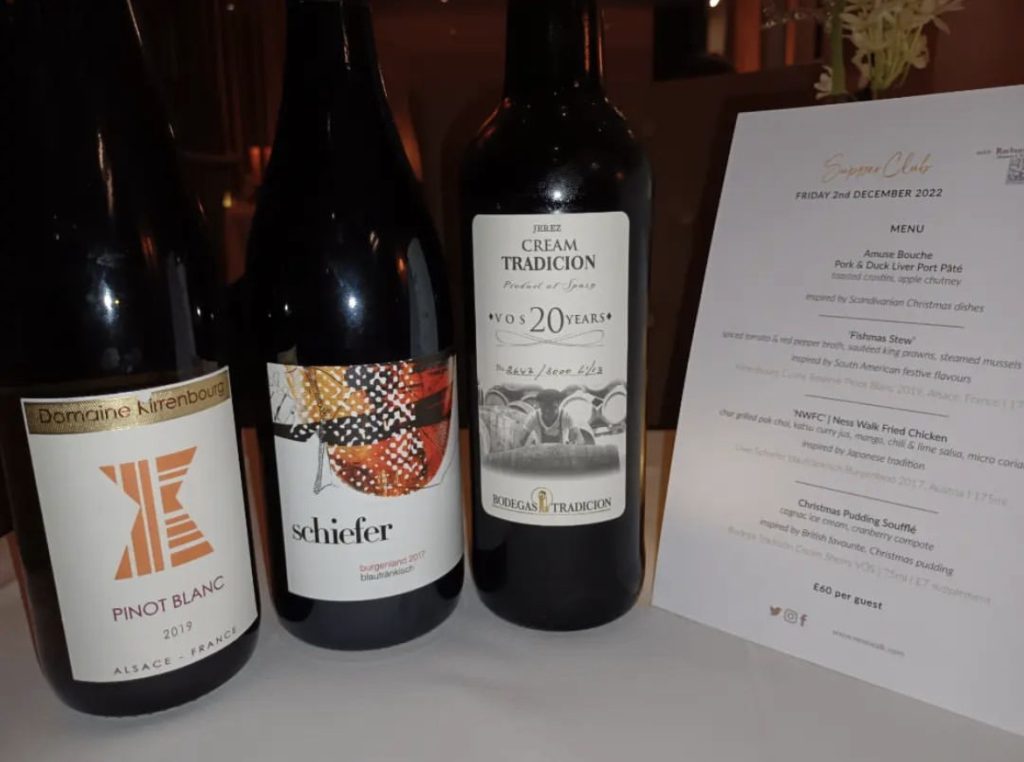 3 bottles of wine alongside a supper club menu from Torrish Restaurant