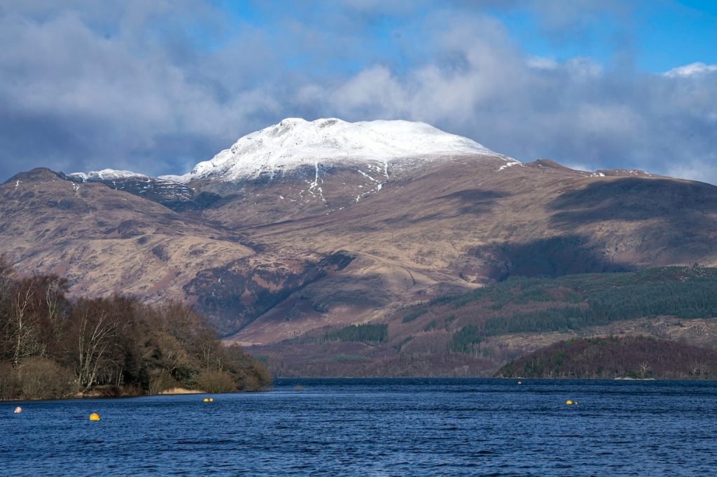 Loch Ness with snowcapped mountains in the distance