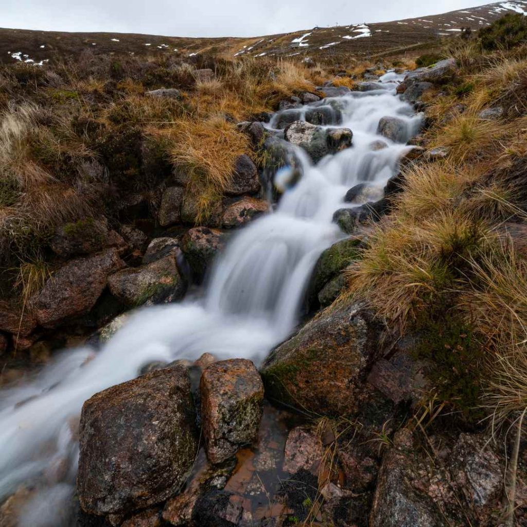 River flowing through Cairngorm Mountains