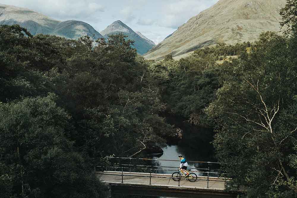 Cycling over a bridge in Scotland.
