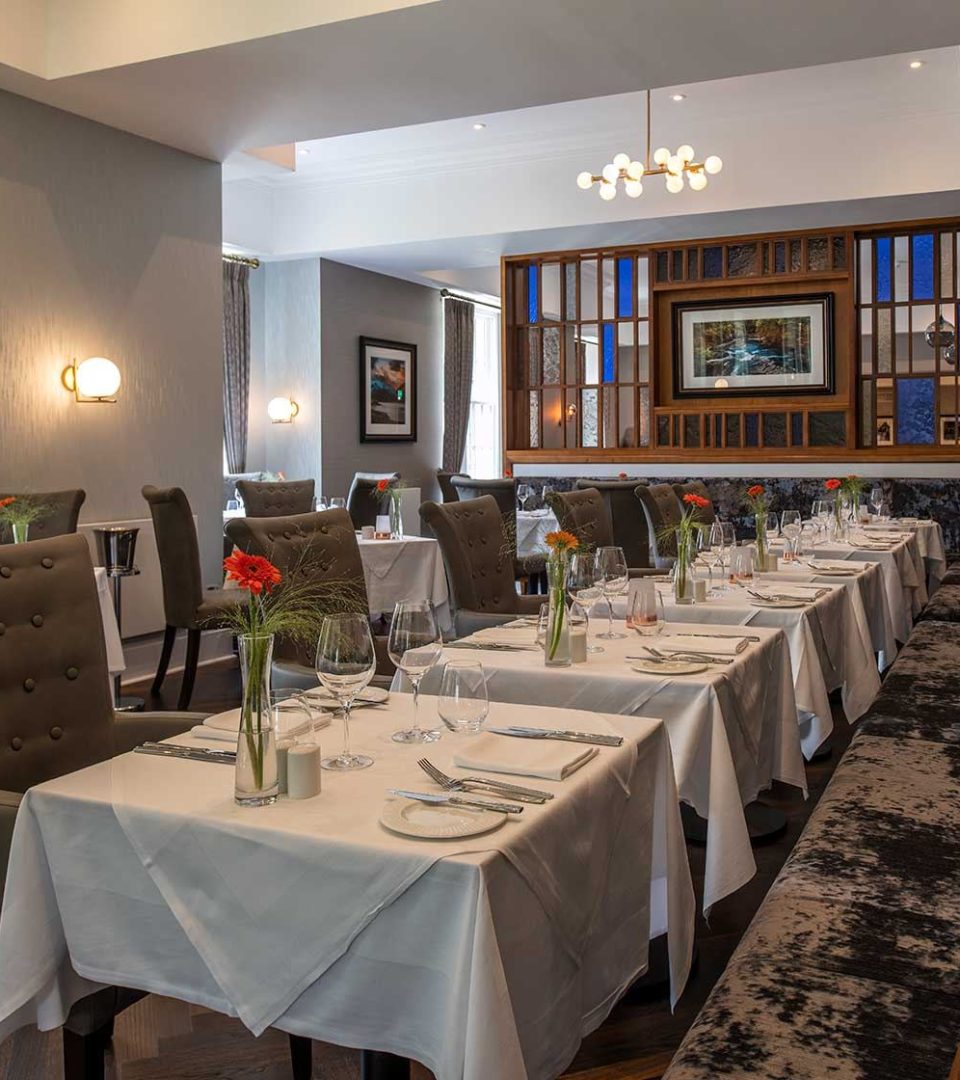 Restaurant tables for dining at Ness Walk Hotel