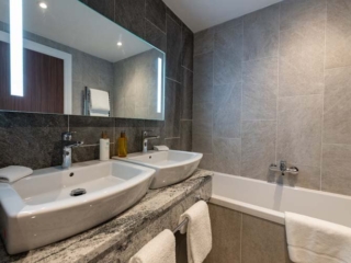 Our standard Ness Walk Hotel bathrooms. All with double sinks and separate WC.