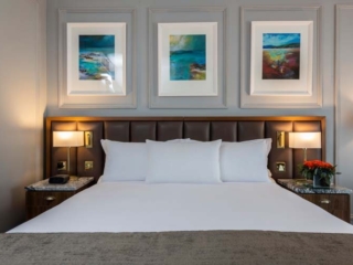 A luxurious large bed as featured in our Laural and Cedar bedrooms