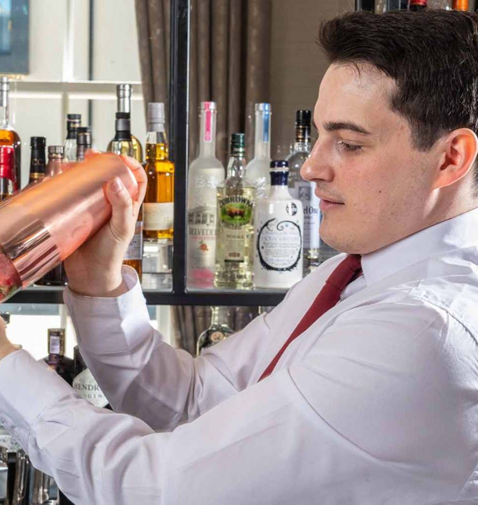 Mark in the Ness Walk Bar, shaking a cocktail. Mark in the Ness Walk Bar, shaking a cocktail.
