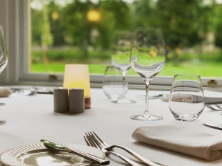 A table in the Torrish Restaurant in a bay window at Ness Walk Hotel, Inverness.