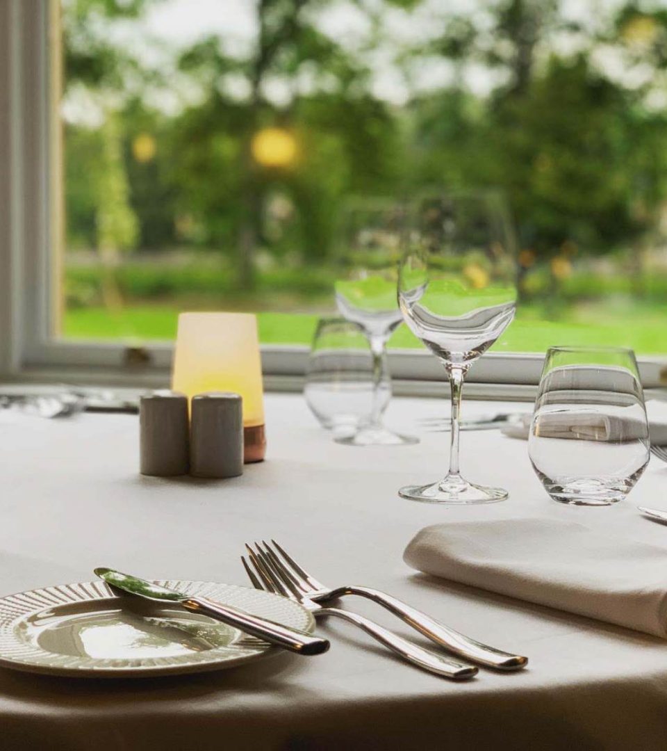 A table in the Torrish Restaurant in a bay window at Ness Walk Hotel, Inverness. A table in the Torrish Restaurant in a bay window at Ness Walk Hotel, Inverness.