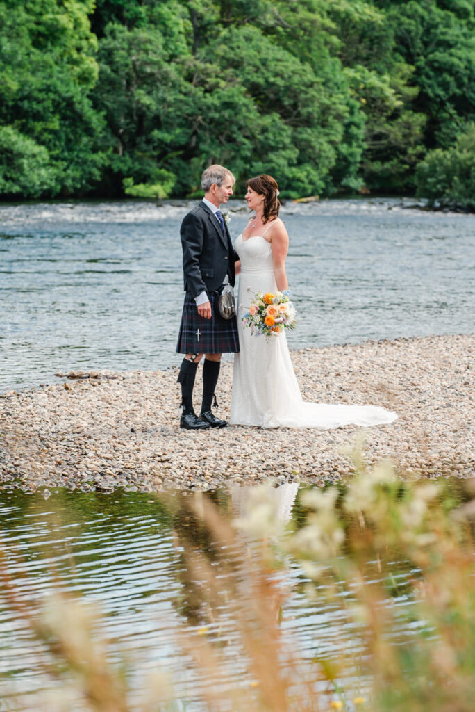 Luxurious Wedding Location in Inverness - couple by River Ness - credit Karen Thorburn