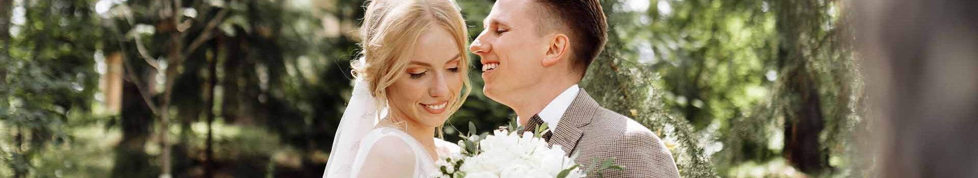 A happy just married couple outdoors.
