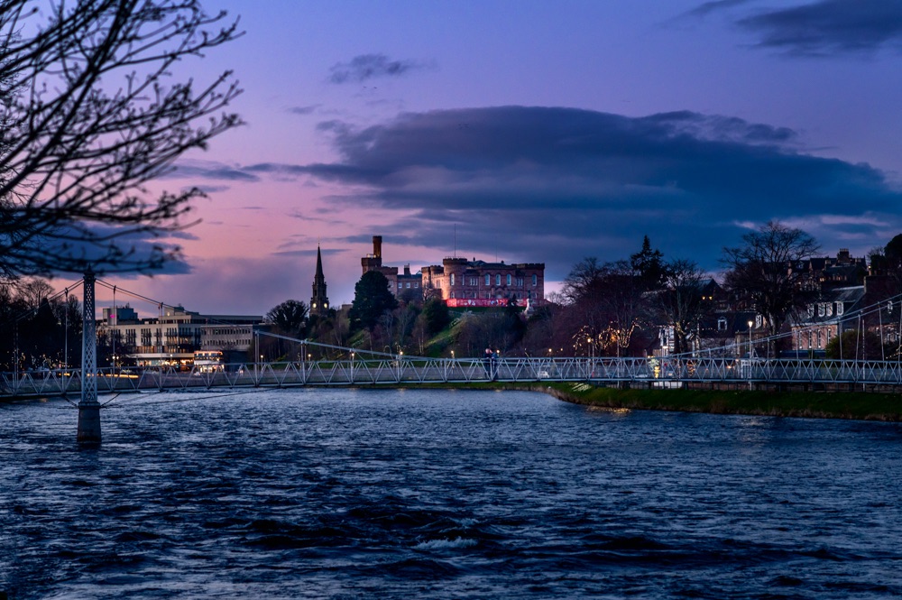 River Ness with Inverness Castle at twilight with bridge in foreground, romantic wedding destinations by Camilla Reynolds