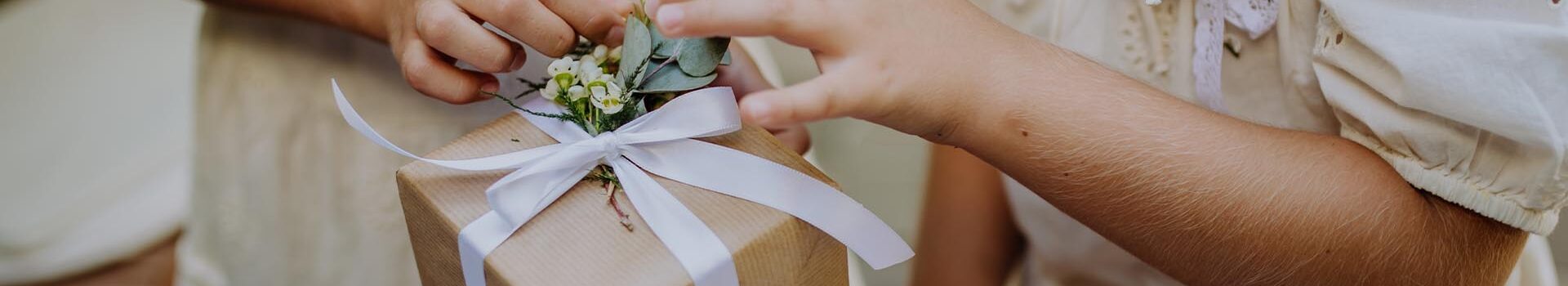 Girls getting an eco-present ready for a wedding.