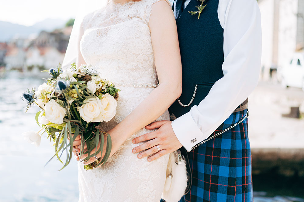 A couple in Scottish tartan getting married.