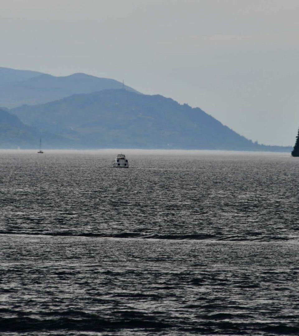 Loch Ness in winter with a boat cruising down
