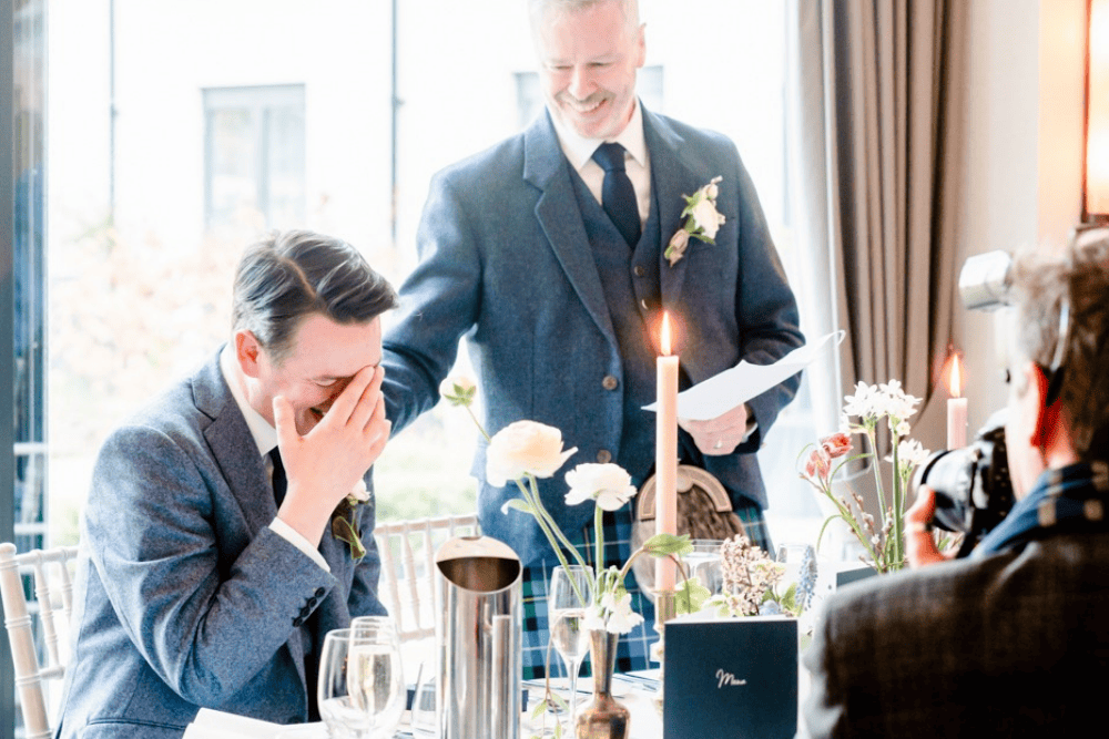 Same sex couple at Ness Walk enjoying their wedding speeches