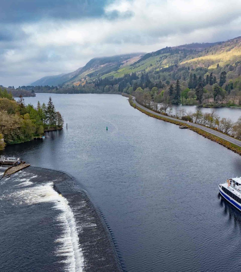 Loch Ness by Jacobite boat sailing out into Loch Ness by the weir